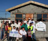 Habitat homeowners and their new home